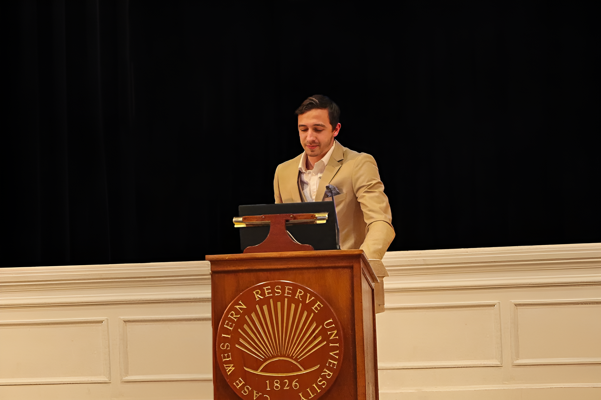 Luke Pastore at CWRU podium